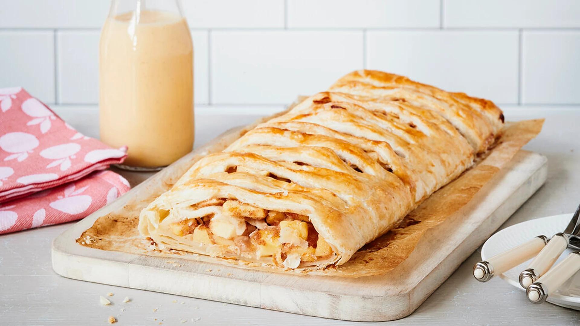 Freshly prepared Viennese-style apple strudel with almonds, raisins, cinnamon, vanilla sugar, and rum.